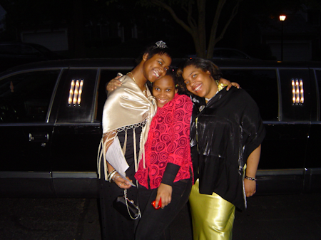 Three sisters beside limo